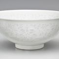 A rare glazed bowl with cut-out decoration, Qianlong seal mark in underglaze blue and of the period (1736-1795)