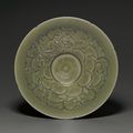 A rare carved Yaozhou 'Peony' bowl, Northern Song dynasty, 11th-12th century