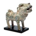 A green-glazed red pottery figure of a dog, Han dynasty (206 BC-AD 220)
