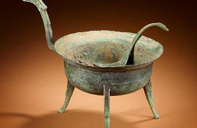 An archaic bronze tripod vessel and spoon, jiaodou. Han Dynasty