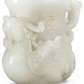 A very rare small white and russet jade vessel in the form of a phoenix, Qing Dynasty, Qianlong period (1736-1795)