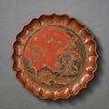 A tianqi and qiangjin lacquer 'landscape' lobed dish, Qianlong mark and period