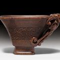 A small rhinoceros horn libation cup with archaistic decoration, China, 17th century