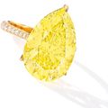 A Unique Fancy Vivid Yellow Diamond and Diamond Ring