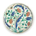 A rimless Iznik pottery dish, Ottoman Turkey, circa 1575