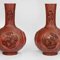 A fine and large pair of carved cinnabar lacquer vases with figural scenes from the Sanguo yanyi, Qianlong-Jiaqing period