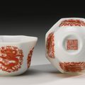 A pair of iron-red octogonal 'Dragon' cups, Daoguang seal marks and period (1821-1850)