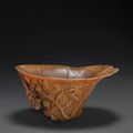 A carved rhinoceros horn libation cup, 17th-18th century