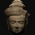 A sandstone head of a male deity, Cambodia, Angkor Period, style of Pre Rup, 10th century