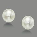 A pair of slightly button-shaped natural pearl ear studs