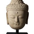 A massive grey stone head of Buddha, Ming dynasty (1368-1644)