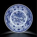 A rare and large Imperial blue and white 'dragon' dish, Qianlong seal mark and of the period (1736-1795)