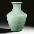 A very fine and rare imperial carved 'archaistic' celadon vase, mark and period of Qianlong (1736-1795)