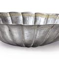 A parcel-gilt silver 'chrysanthemum' bowl, China, Song dynasty (AD 960-1279)