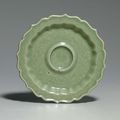 A Longquan celadon carved barbed cup stand, Hongwu period (1368-1398) 