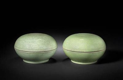 A pair of green-glazed incised circular bowls and covers. Guangxu six-character marks and of the period