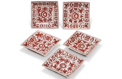 A rare set of five iron-red-decorated ‘crane and trigrams’ square dishes, Jiajing marks and period (1522-1566)