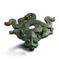 An archaic bronze 'mythical beast' stand, Eastern Zhou dynasty (770-221 BC)