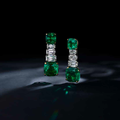 A pair of emerald and diamond pendant earrings