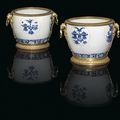 A near pair of French ormolu-mounted Chinese porcelain cache-pots, the porcelain Kangxi period, circa 1662-1722, the ormolu 19th