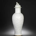 A rare white-glazed relief-decorated vase and cover. Qianlong-Jiaqing