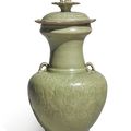 A 'Longquan' celadon-glazed 'floral' vase and cover, Five Dynasties-Northern Song dynasty (907-1126)
