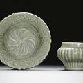 A carved celadon-glazed dish, Ming dynasty