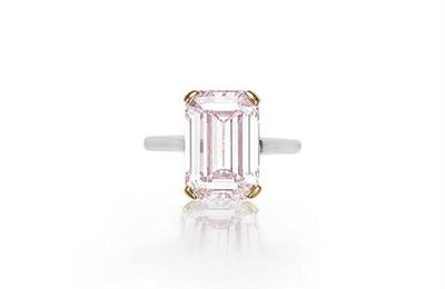 A rectangular-cut light pink diamond ring