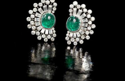 A pair of emerald and diamond earclips, circa 1955