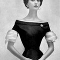Dovima modeling a black sheath dress by Adele Simpson, Vogue Feb 1954.