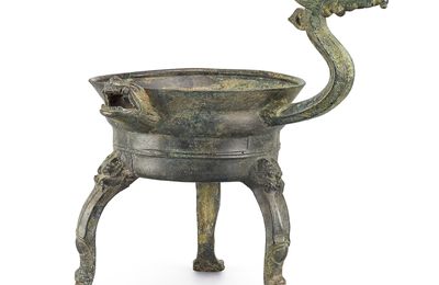 An inscribed archaic bronze ritual lamp, jiaodou, Six Dynasties period (317-587)