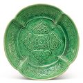 A molded green-glazed pottery dish, Liao dynasty (907-1125)