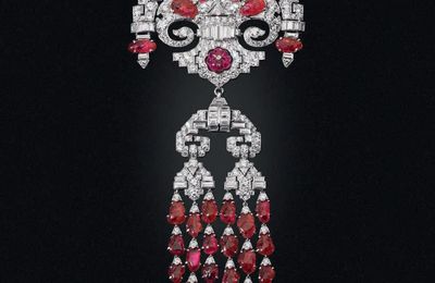 An Art Deco carved ruby and diamond brooch, attributed to Lacloche Frères