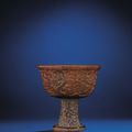 A rare and finely carved rhinoceros horn 'Hundred boys' stem cup, Late Ming-early Qing dynasty, 17th century 