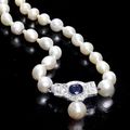 A single-row pearl necklace with sapphire and diamond clasp, circa 1930