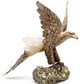 Cartier. Importante statue en argent doré faite d'un aigle aux ailes déployées