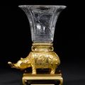 A rare French late 19th century 'Japonisant' gilt-bronze and cut-crystal vase on elephant support. By Baccarat