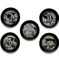 A set of five mother-of-pearl-inlaid black lacquer circular dishes, 17th century