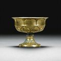A fine gilt-bronze petal-shaped stemcup, Tang dynasty (618-907)