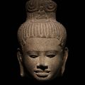 A sandstone head of Avalokiteshvara, Cambodia, Baphuon style, 11th century