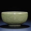 A fine and very rare carved early Ming Longquan celadon deep bowl, Ming dynasty, 15th century