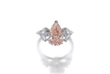 Attractive fancy orangy pink diamond ring 