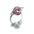 Orangy-pink sapphire and diamond ring