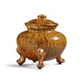 A rare amber-glazed marbled pottery tripod jar and cover, Tang dynasty 618-907)