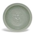 A moulded ‘Longquan’ celadon ‘dragon’ dish, Yuan dynasty (1279-1366)