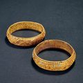 A pair of turquoise-inlaid gold bracelets, Tang dynasty, 7th-10th century