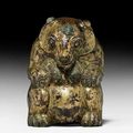 A gilt cast-bronze figure of a seated bear, Western Han dynasty (206 BC-AD 24)