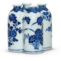 A blue and white 'flowers of the four seasons' conjoined vase, Qianlong seal mark in underglaze blue and of the period