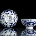 A fine and rare pair of blue and white 'dragon' bowls, underglaze blue Yongzheng six-character marks and of the period