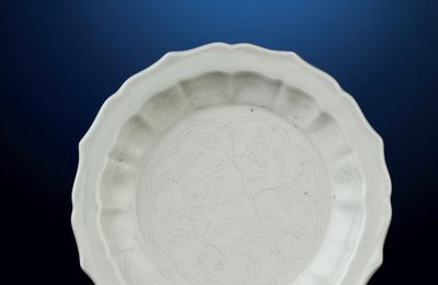 A fine incised white-glazed barbed-rim dish, Yongle period (1403-1424)